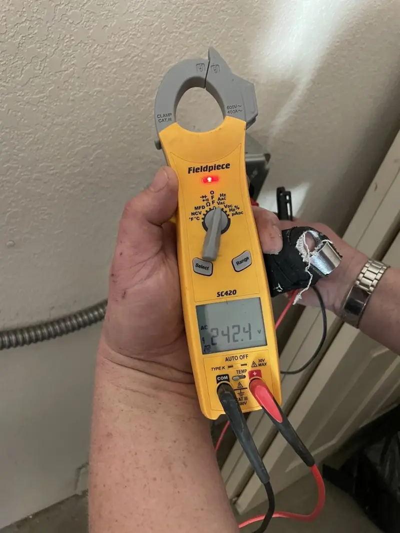 Voltage testing with clamp meter during Ceiling Fan Installation in Poplar Bluff